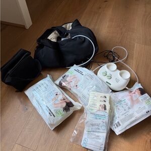 Ameda Pump with lots of baby accessories that are like new